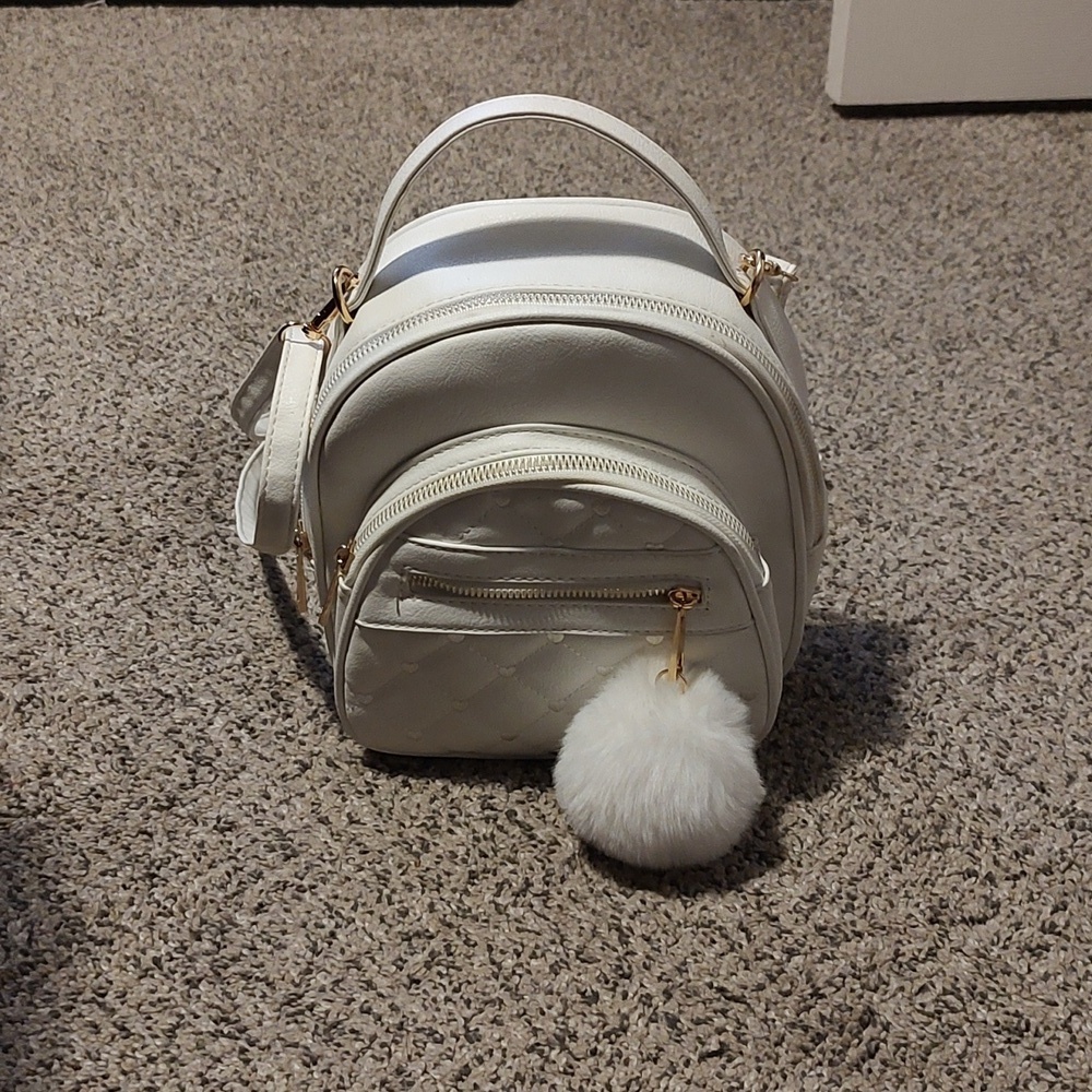 Girls white backpack with Pom